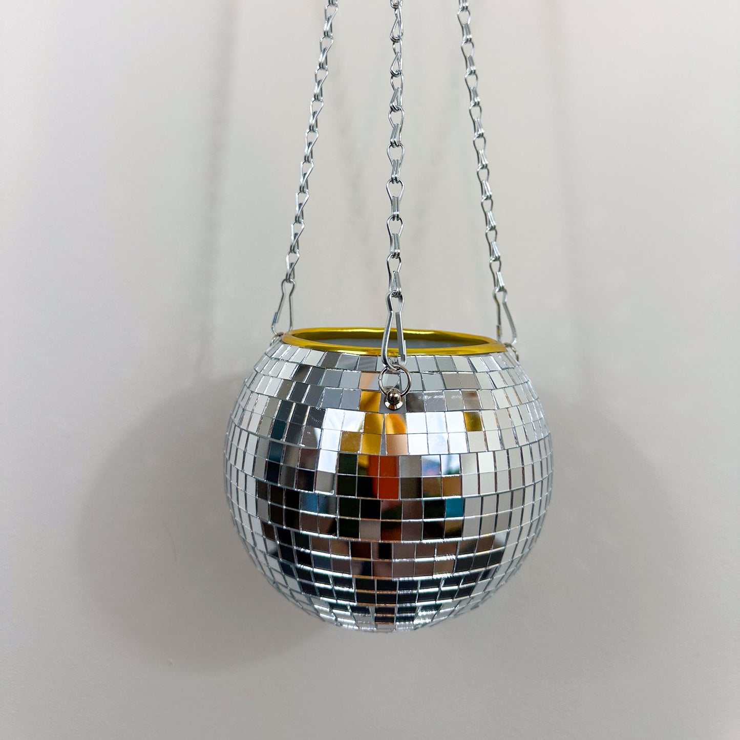 close up of hanging disco ball planter