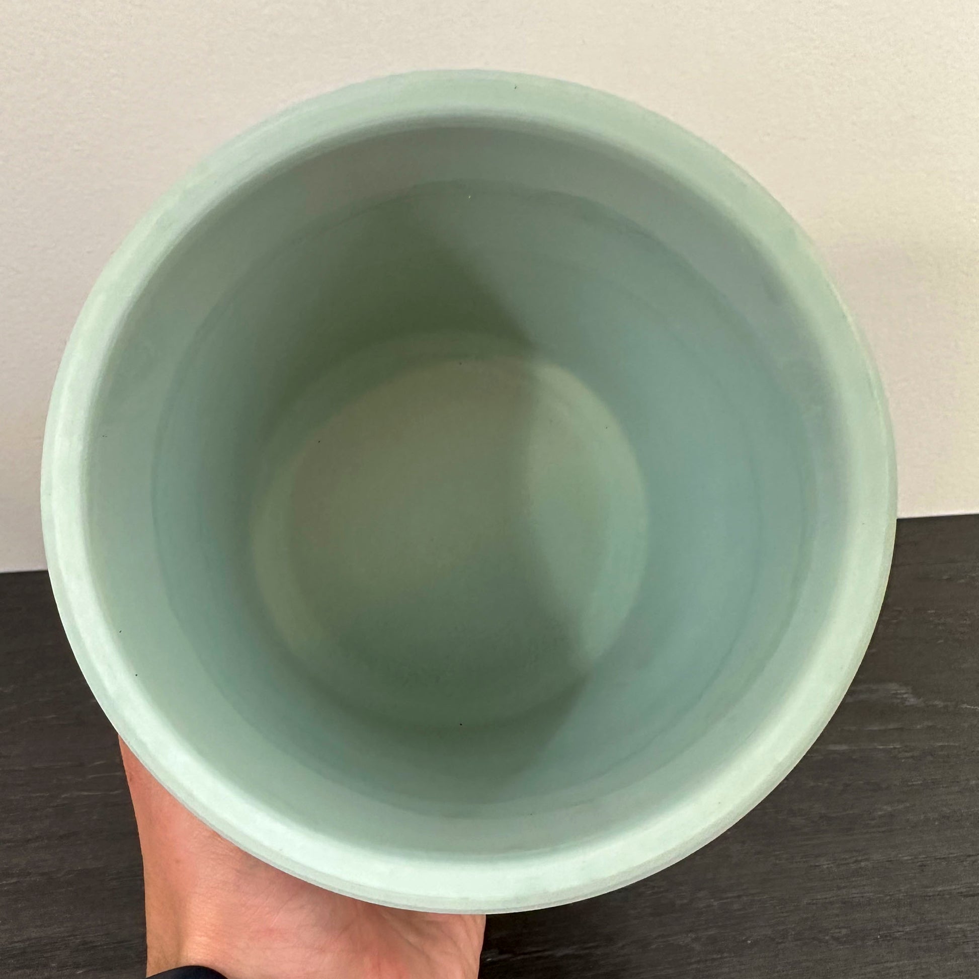 close up of inside of decorative mint green 5" pot 